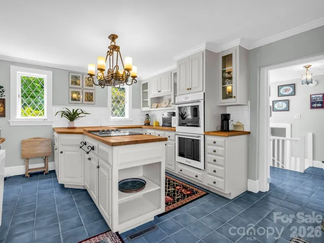 a living room with a table and a window