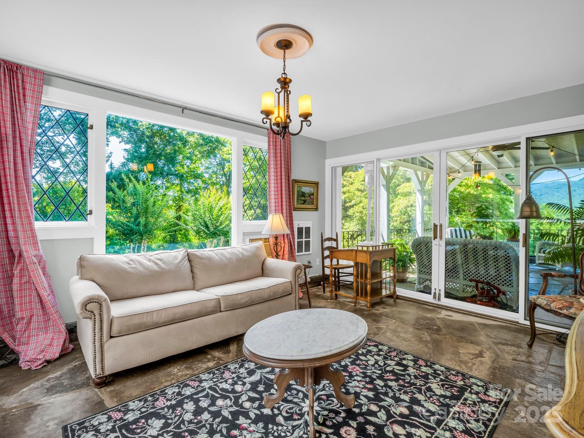 287 Pacolet Ridge Lane Tryon, NC 28782 - Photo 22 of 48 a living room with furniture and a large window