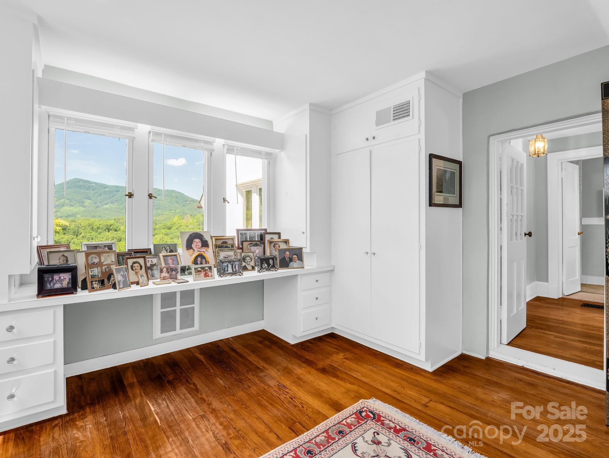 287 Pacolet Ridge Lane Tryon, NC 28782 - Photo 29 of 48 a view of a bedroom with wooden floor and a window