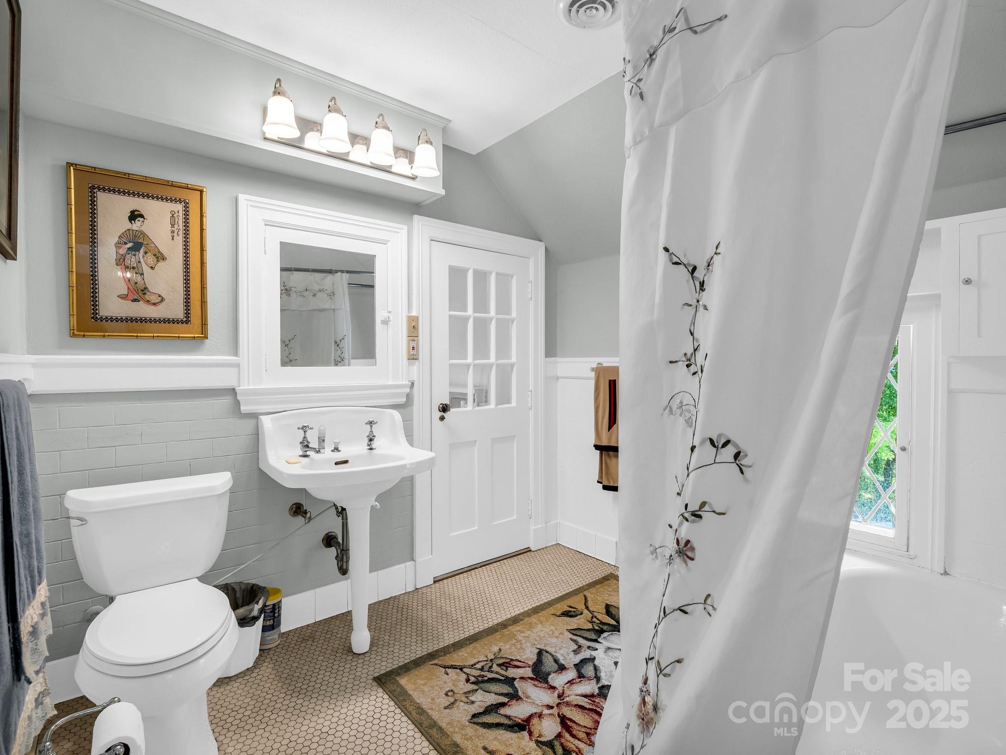 287 Pacolet Ridge Lane Tryon, NC 28782 - Photo 35 of 48 a bathroom with a sink toilet and shower