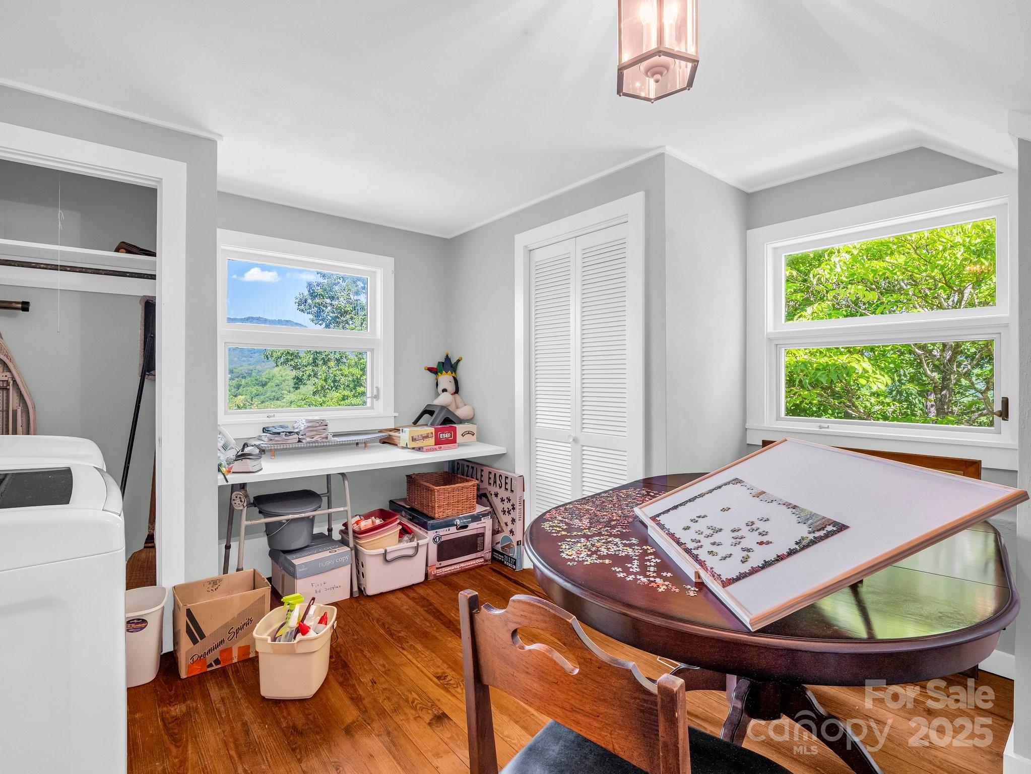 287 Pacolet Ridge Lane Tryon, NC 28782 - Photo 36 of 48 a living room with a table and a window