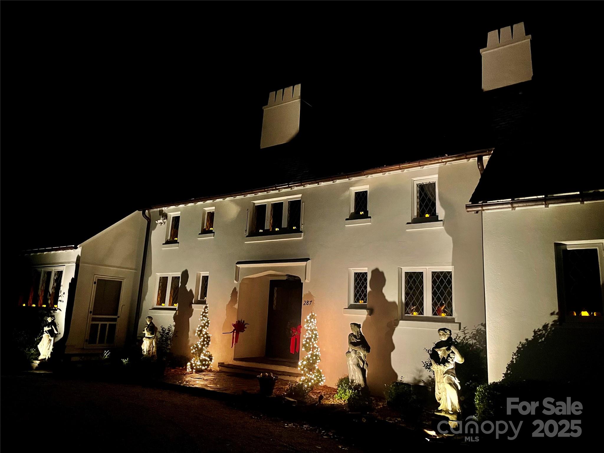 287 Pacolet Ridge Lane Tryon, NC 28782 - Photo 37 of 48 a front view of a building with many windows