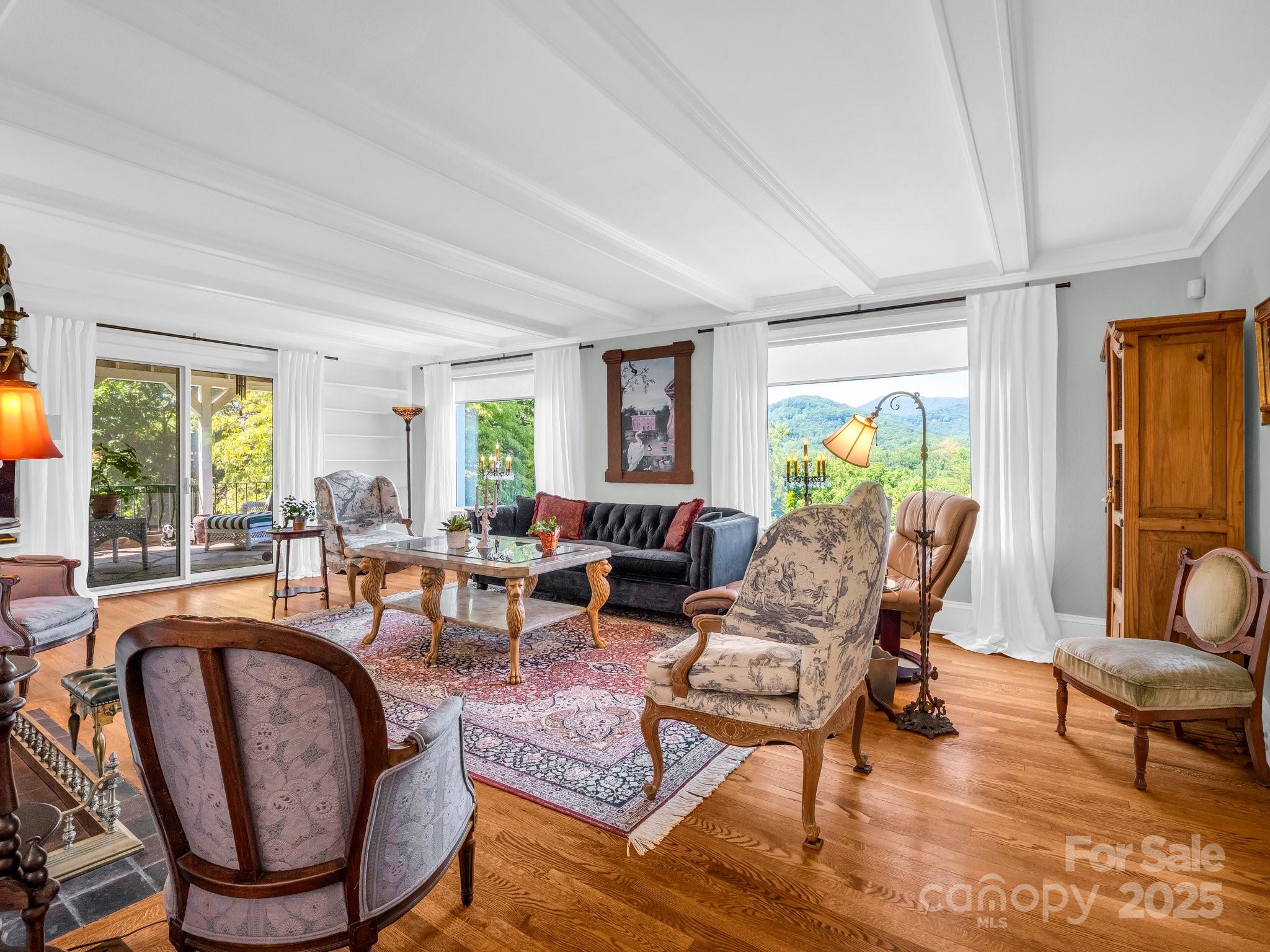 287 Pacolet Ridge Lane Tryon, NC 28782 - Photo 7 of 48 a living room with fireplace furniture and a large window