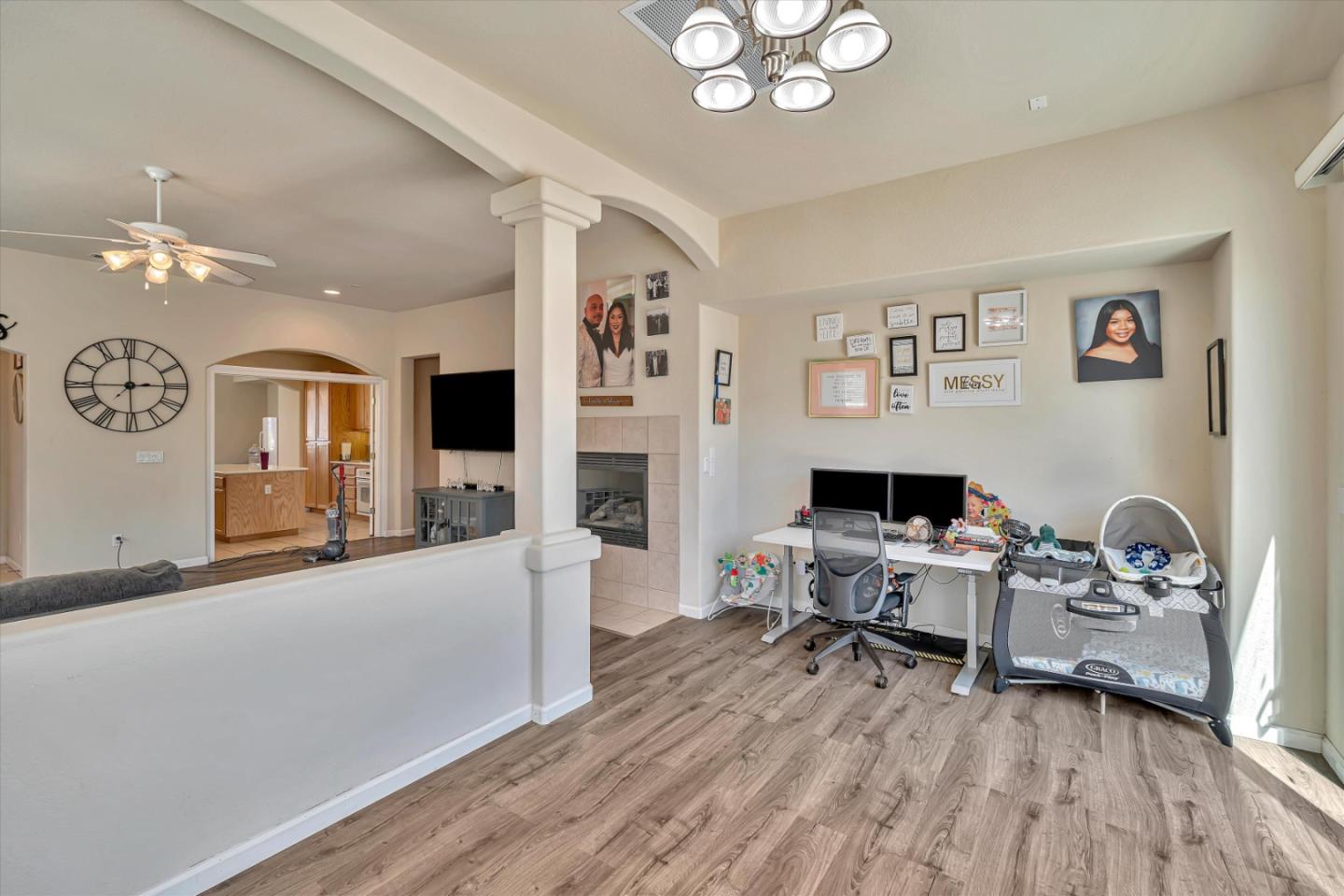 390 Munter Street Manteca, CA 95337 - Photo 13 of 26 a view of a livingroom with workspace and a window