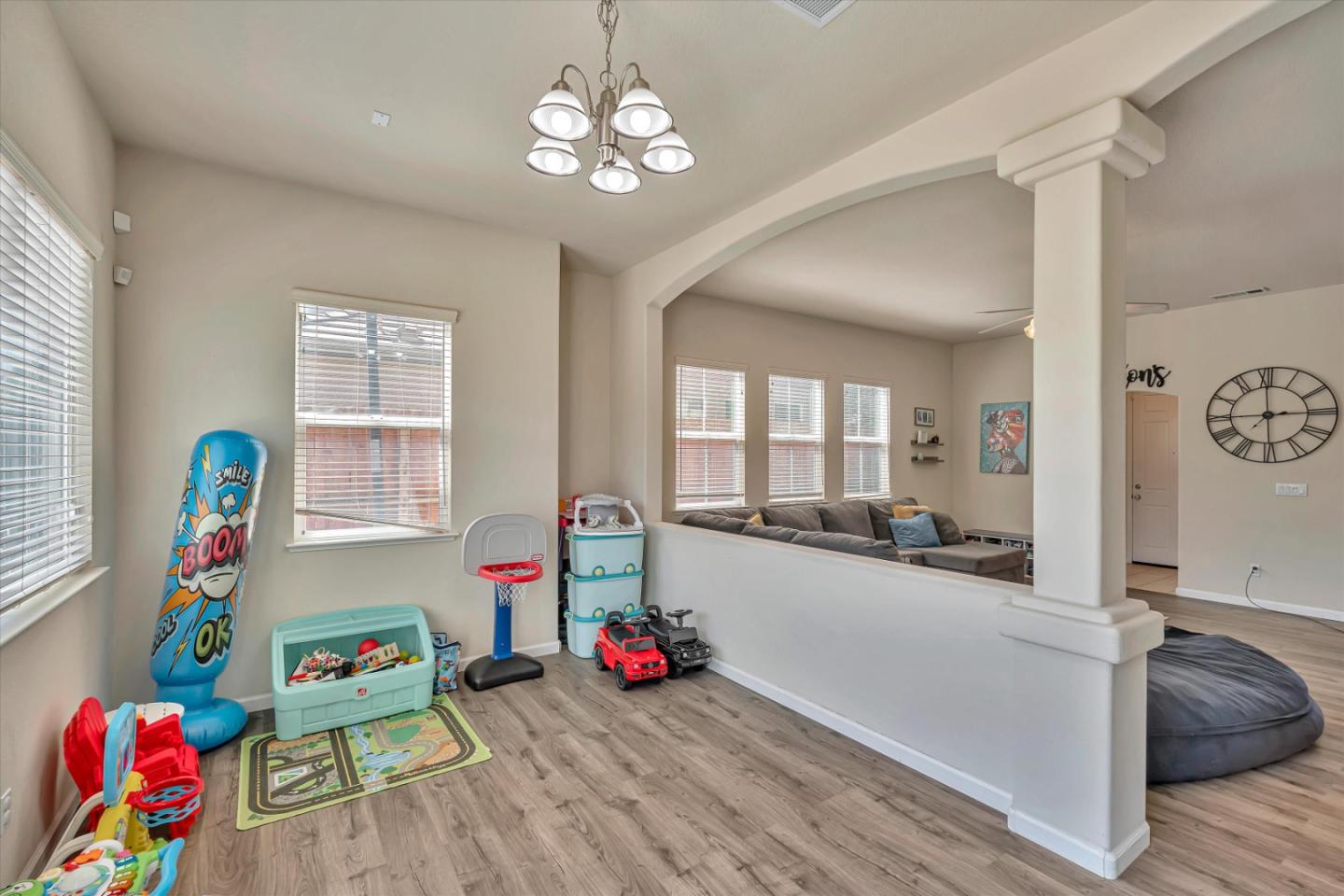 390 Munter Street Manteca, CA 95337 - Photo 14 of 26 a living room with furniture and a wooden floor