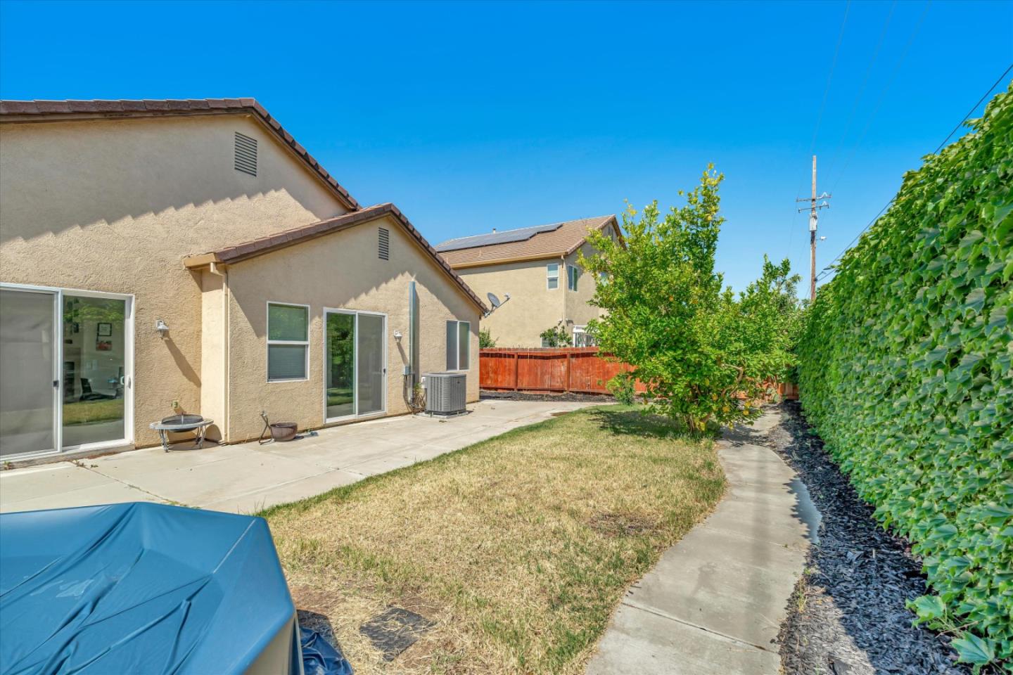 390 Munter Street Manteca, CA 95337 - Photo 25 of 26 a front view of a house with garden