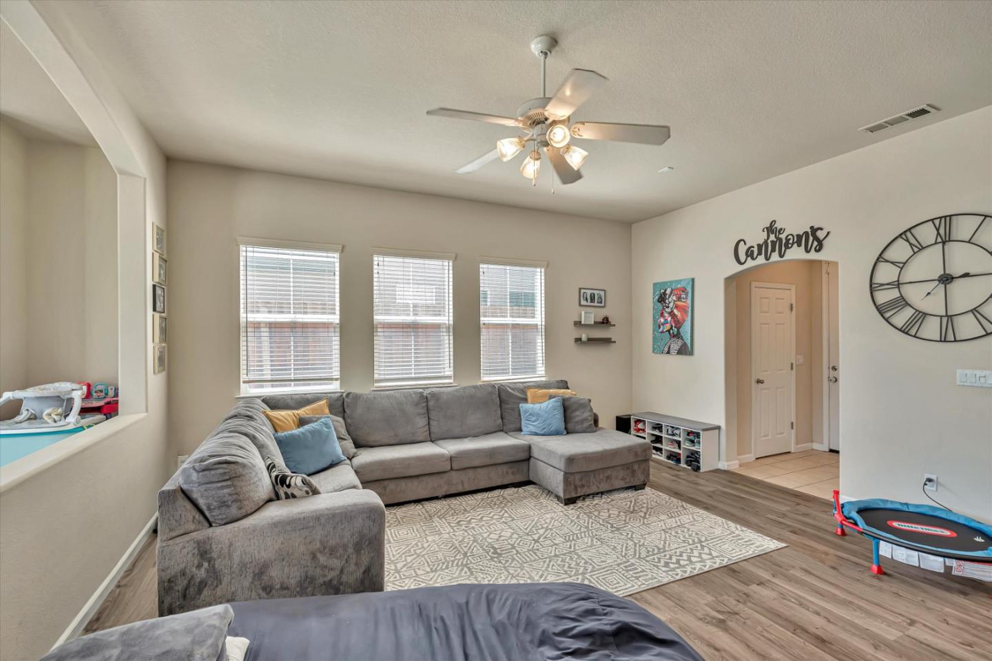 390 Munter Street Manteca, CA 95337 - Photo 3 of 26 a living room with furniture and wooden floor