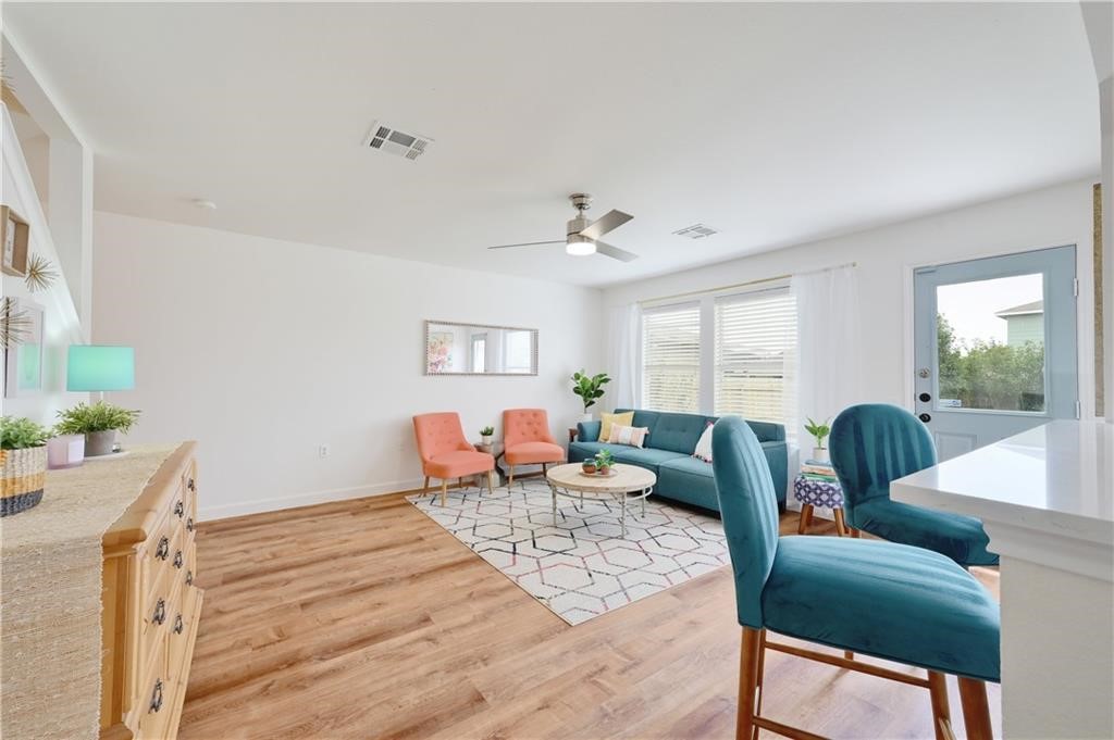 12329 Sky Harbor Drive Del Valle, TX 78617 - Photo 22 of 29 a living room with furniture and wooden floor