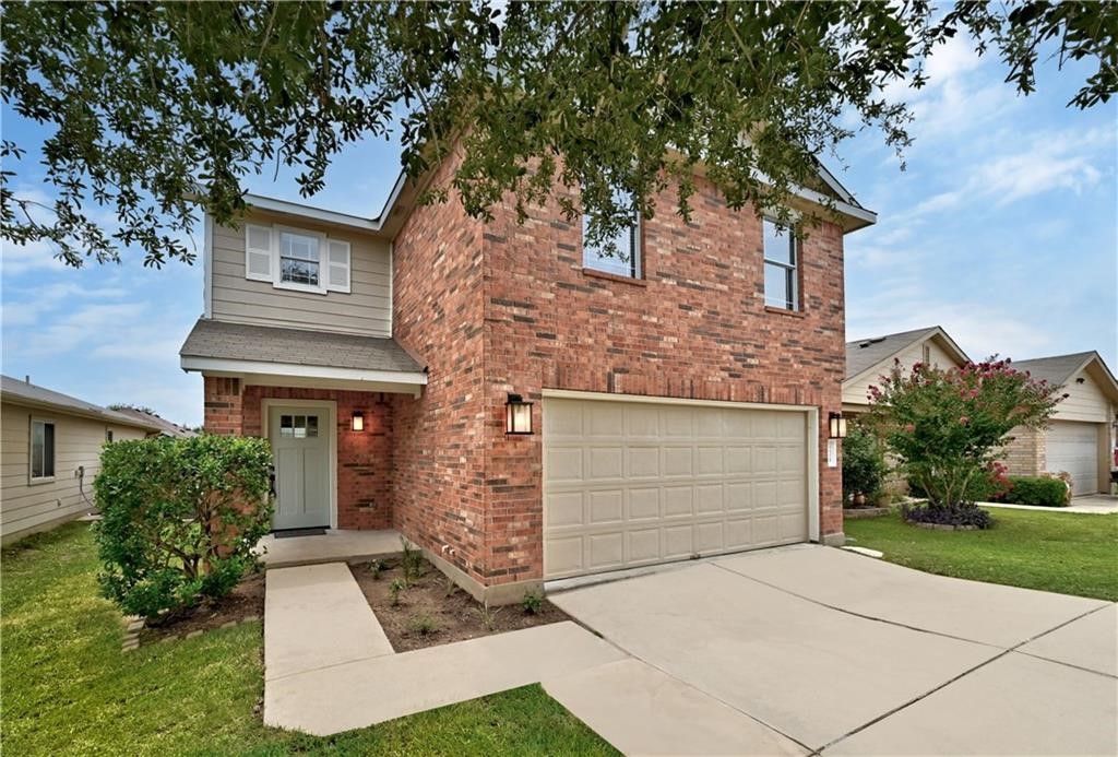 12329 Sky Harbor Drive Del Valle, TX 78617 - Photo 28 of 29 front view of a house with a yard