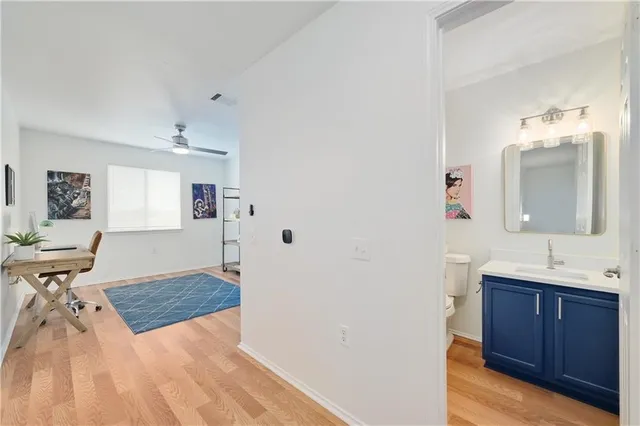 a spacious bathroom with a sink and a mirror