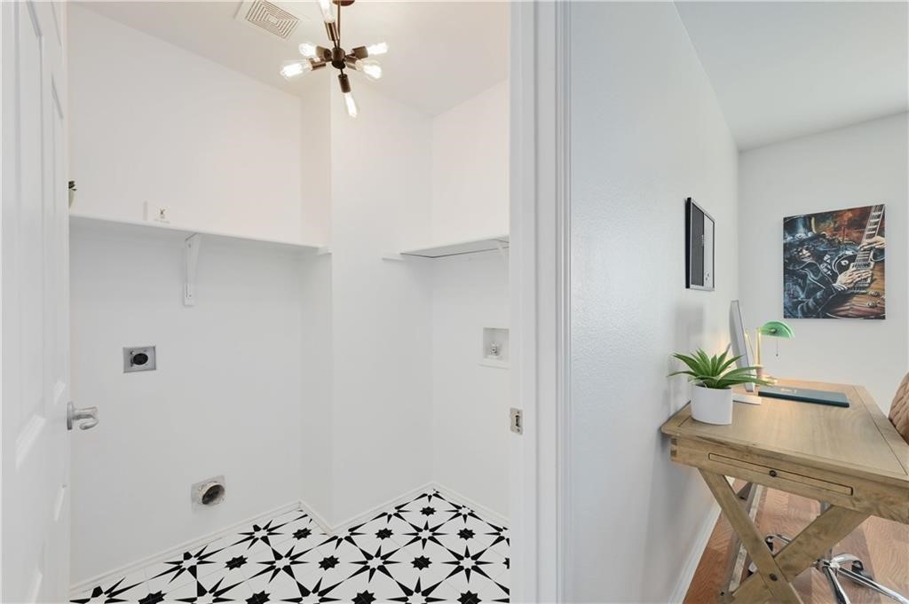 12329 Sky Harbor Drive Del Valle, TX 78617 - Photo 9 of 29 a view of kitchen with furniture and wooden floor