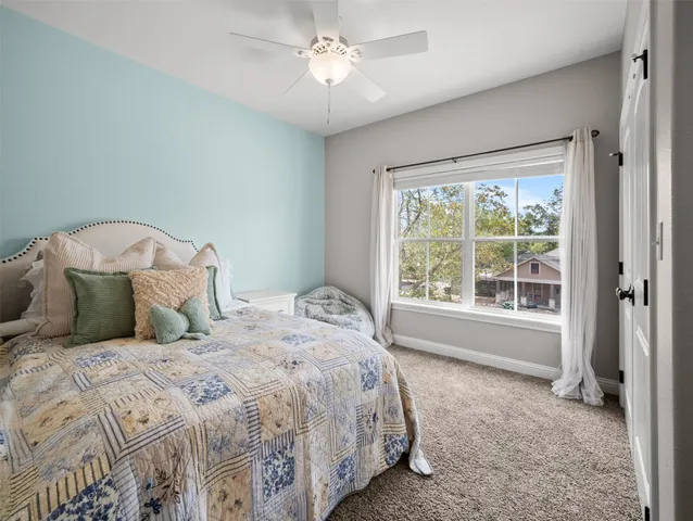 a house view with swimming pool in front of it