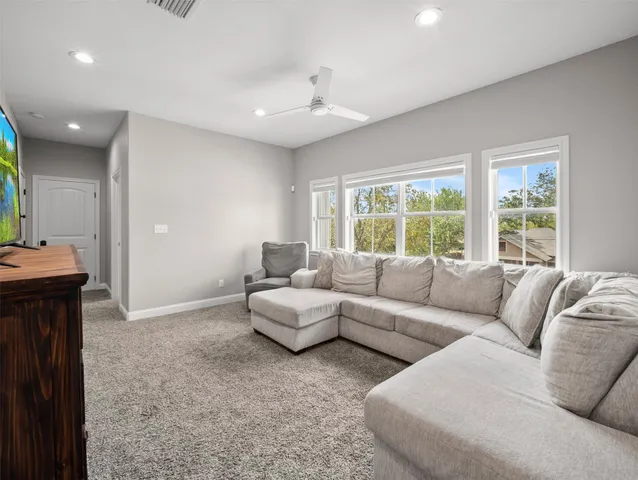 a view of a house with a backyard and a garden