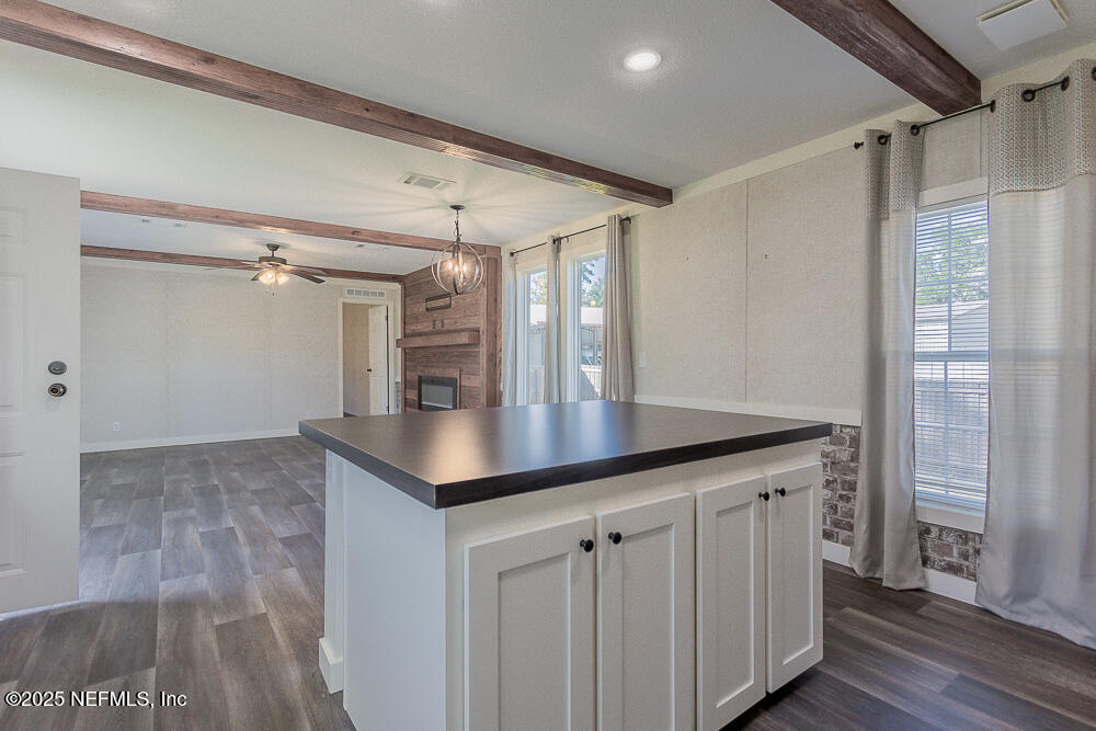 475 AJ Mills Road Ponte Vedra, FL 32081 - Photo 17 of 34 a kitchen with white cabinets a sink and dishwasher