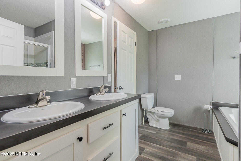 475 AJ Mills Road Ponte Vedra, FL 32081 - Photo 20 of 34 a bathroom with a sink and a mirror