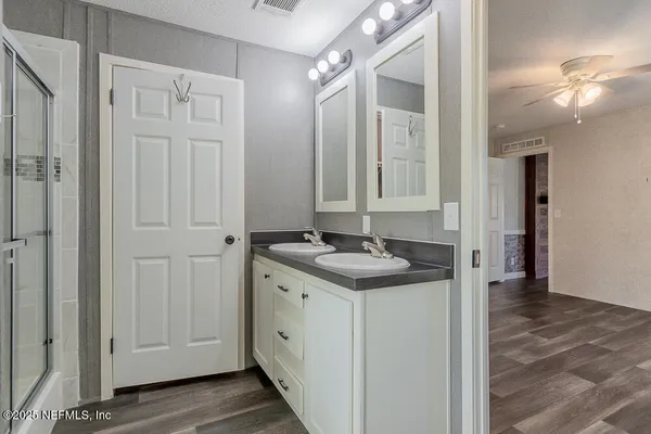 a bathroom with a sink and a mirror