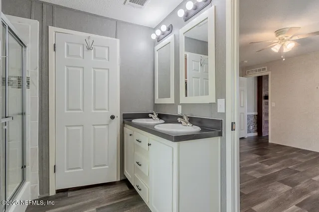 a bathroom with a sink and a mirror