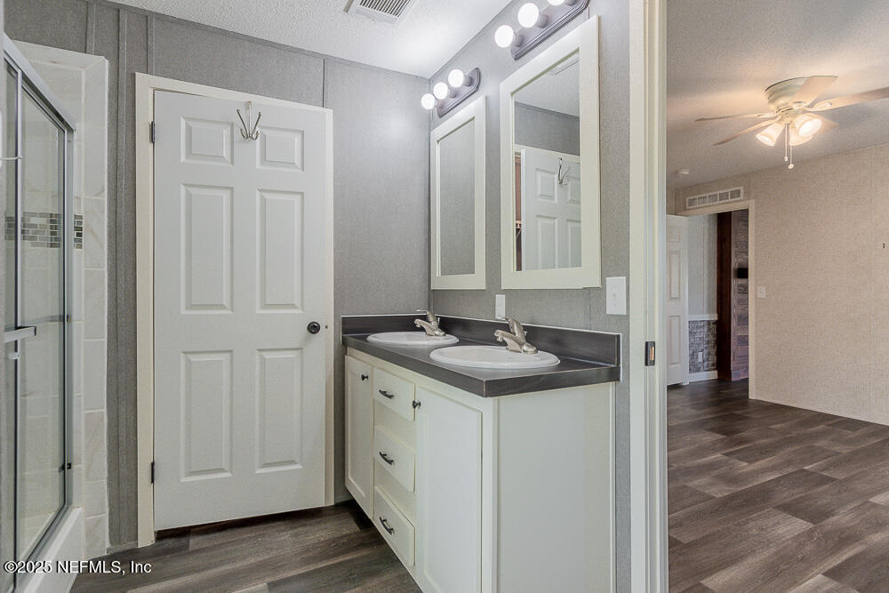 475 AJ Mills Road Ponte Vedra, FL 32081 - Photo 23 of 34 a bathroom with a sink and a mirror