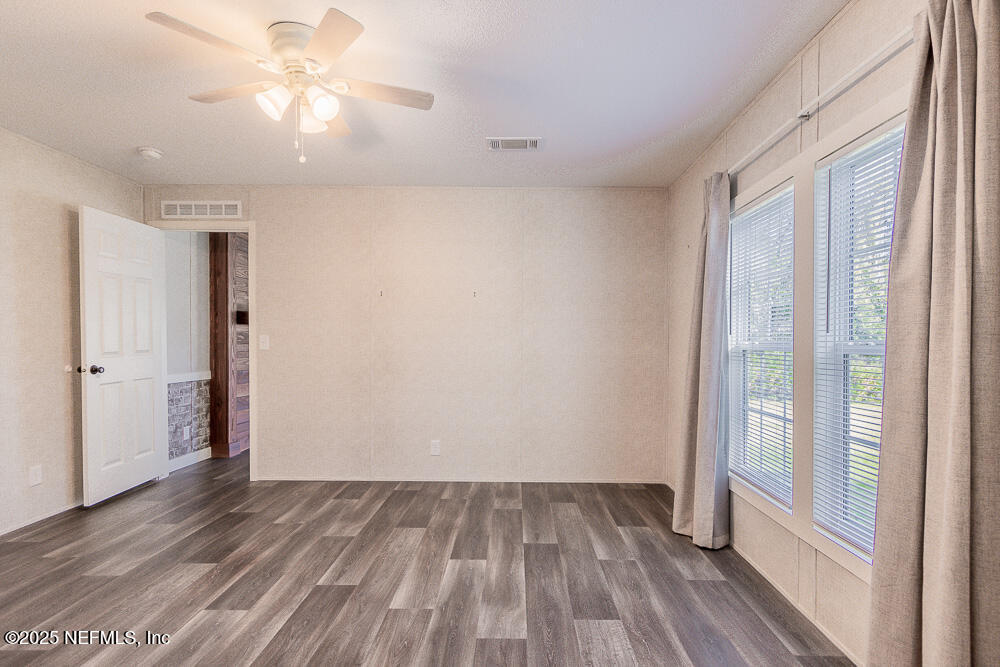 475 AJ Mills Road Ponte Vedra, FL 32081 - Photo 24 of 34 wooden floor in an empty room with a window