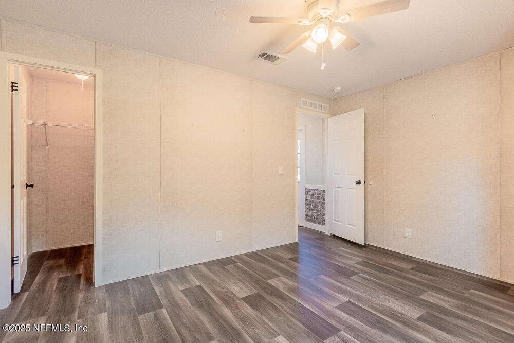 475 AJ Mills Road Ponte Vedra, FL 32081 - Photo 25 of 34 a view of empty room with wooden floor and fan