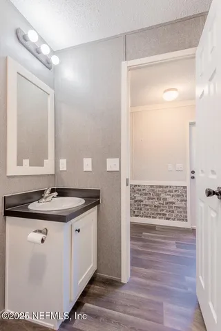 a bathroom with a sink and a mirror