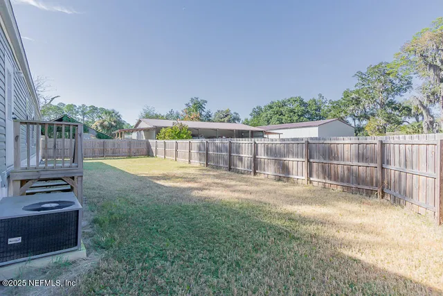 a view of a back yard with a small garden
