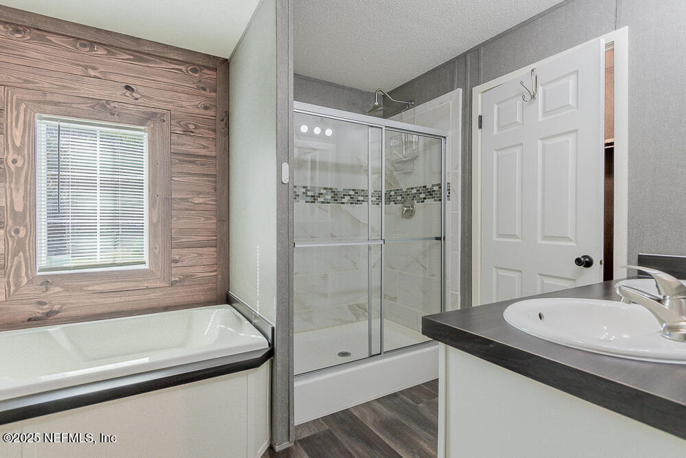 475 AJ Mills Road Ponte Vedra, FL 32081 - Photo 5 of 34 a bathroom with a granite countertop sink a toilet and shower