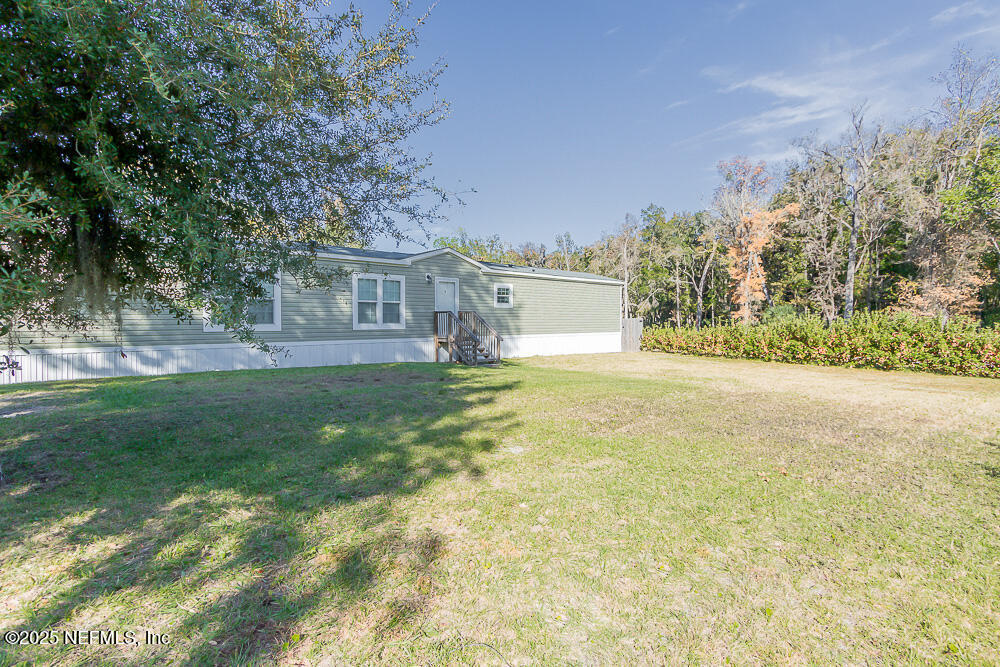 475 AJ Mills Road Ponte Vedra, FL 32081 - Photo 7 of 34 a front view of house with yard and trees