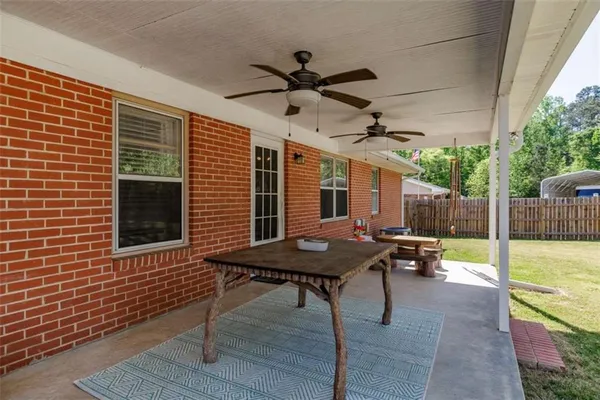 a view of a dinning table and chair in the patio