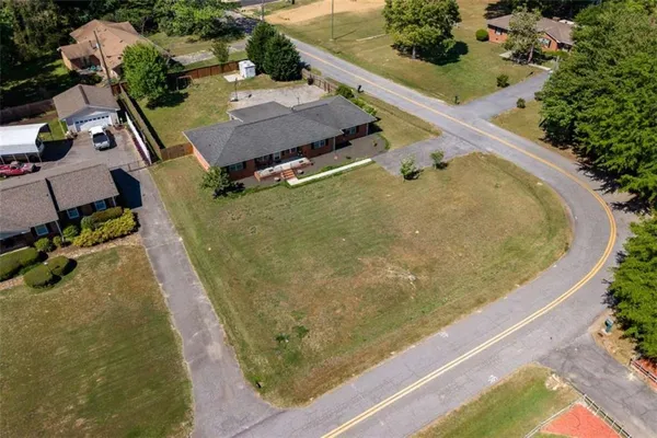 an aerial view of a house with a swimming pool