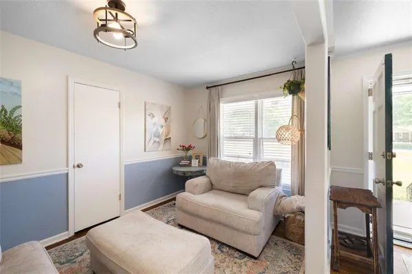 a living room with furniture and a window