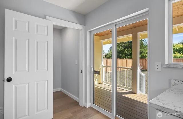 a view of a room that has a bed in it