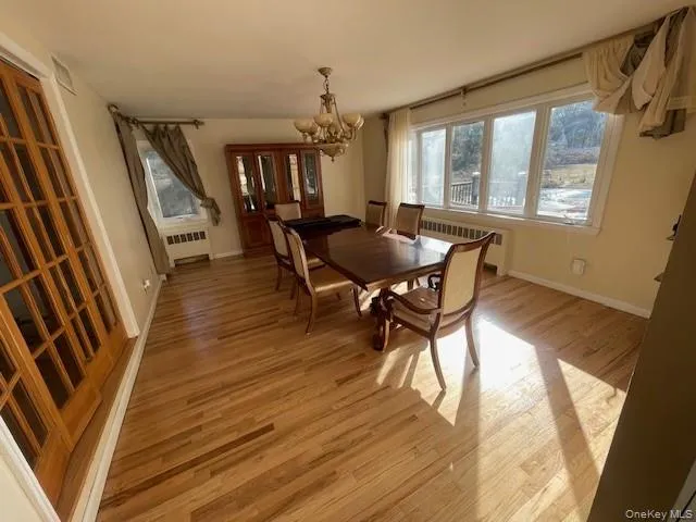 a dining room with furniture and window
