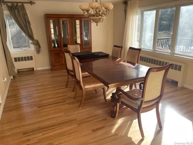 a view of a dining room with furniture and window