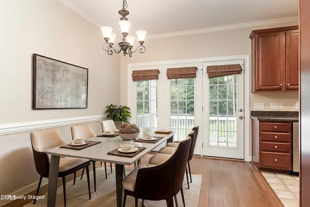 a kitchen with stainless steel appliances granite countertop a refrigerator a stove a sink and a microwave