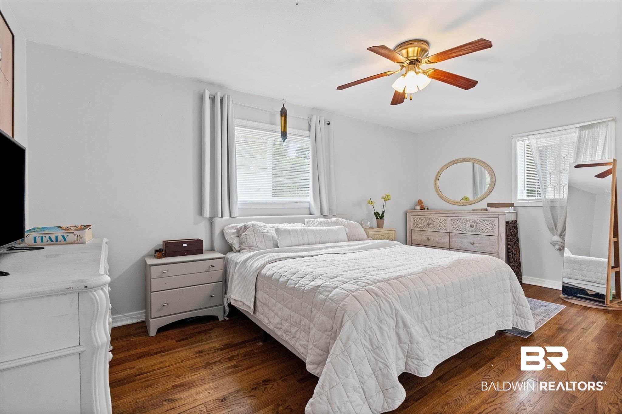 4213 Shan Drive East Mobile, AL 36693 - Photo 12 of 35 Hardwood flooring and light-toned walls create a neutral palette