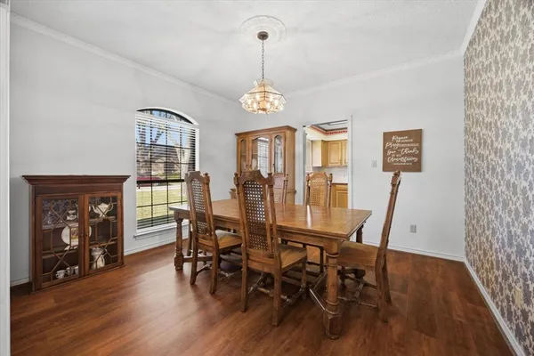 a living room with furniture a fireplace and a large mirror
