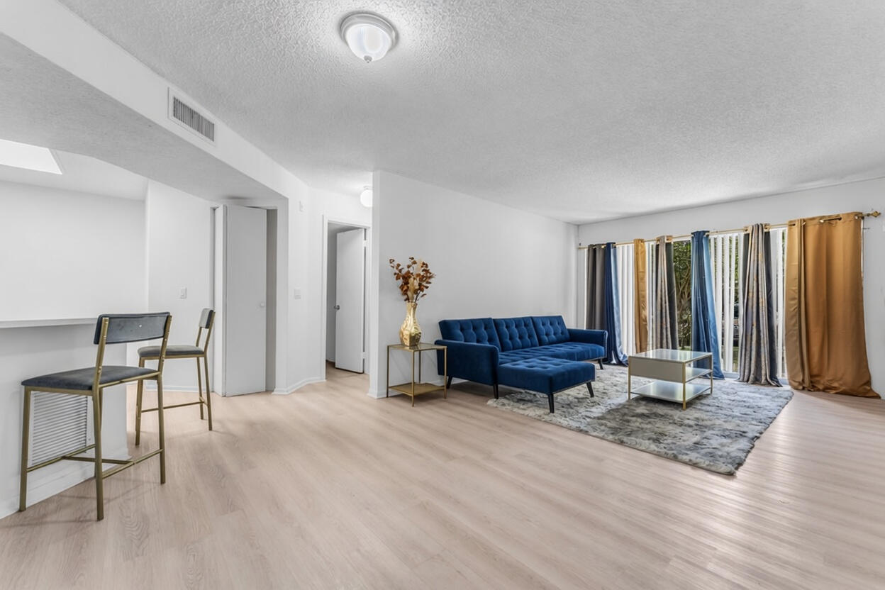 8721 Wiles Road, Unit 103 Coral Springs, FL 33067 - Photo 5 of 25 Decluttered Living Room