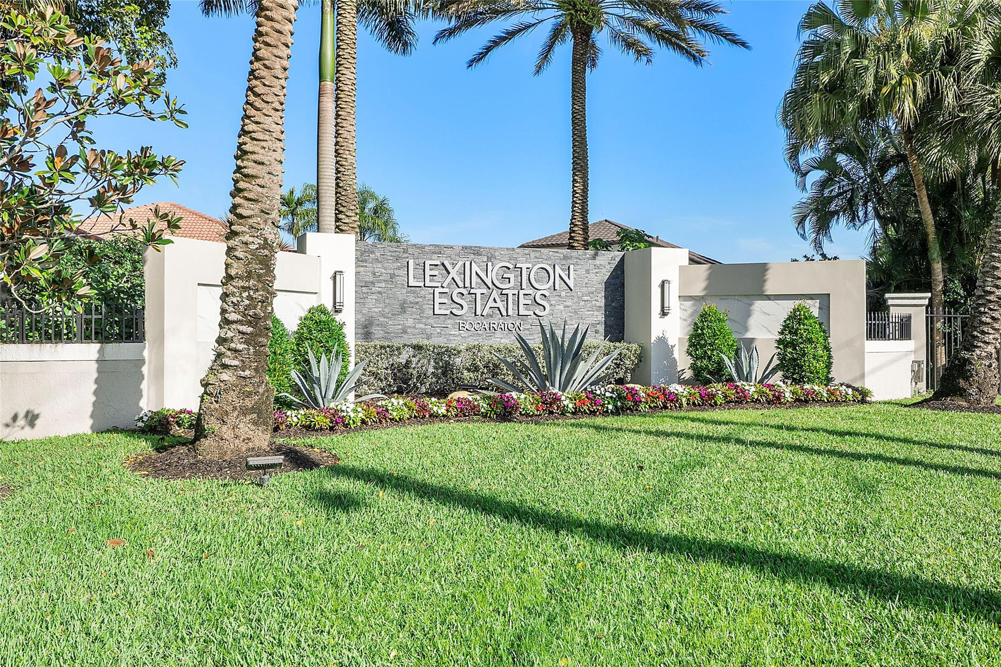 22293 Rushmore Place Boca Raton, FL 33428 - Photo 1 of 59 a front view of a house with a garden and plants