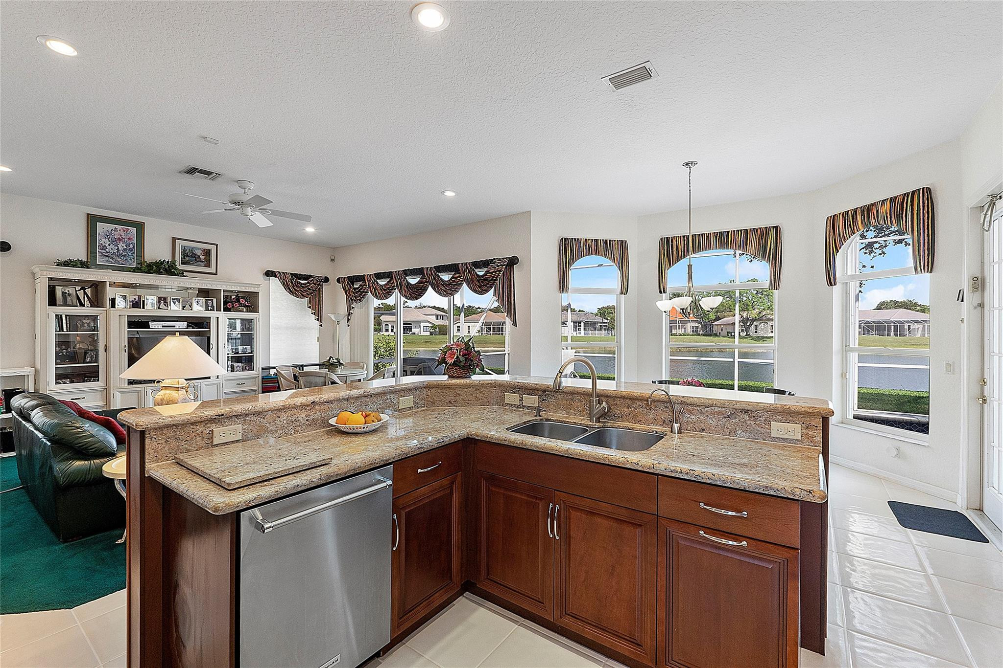 22293 Rushmore Place Boca Raton, FL 33428 - Photo 14 of 59 a utility room with stainless steel appliances granite countertop a sink and dishwasher a stove with wooden floor
