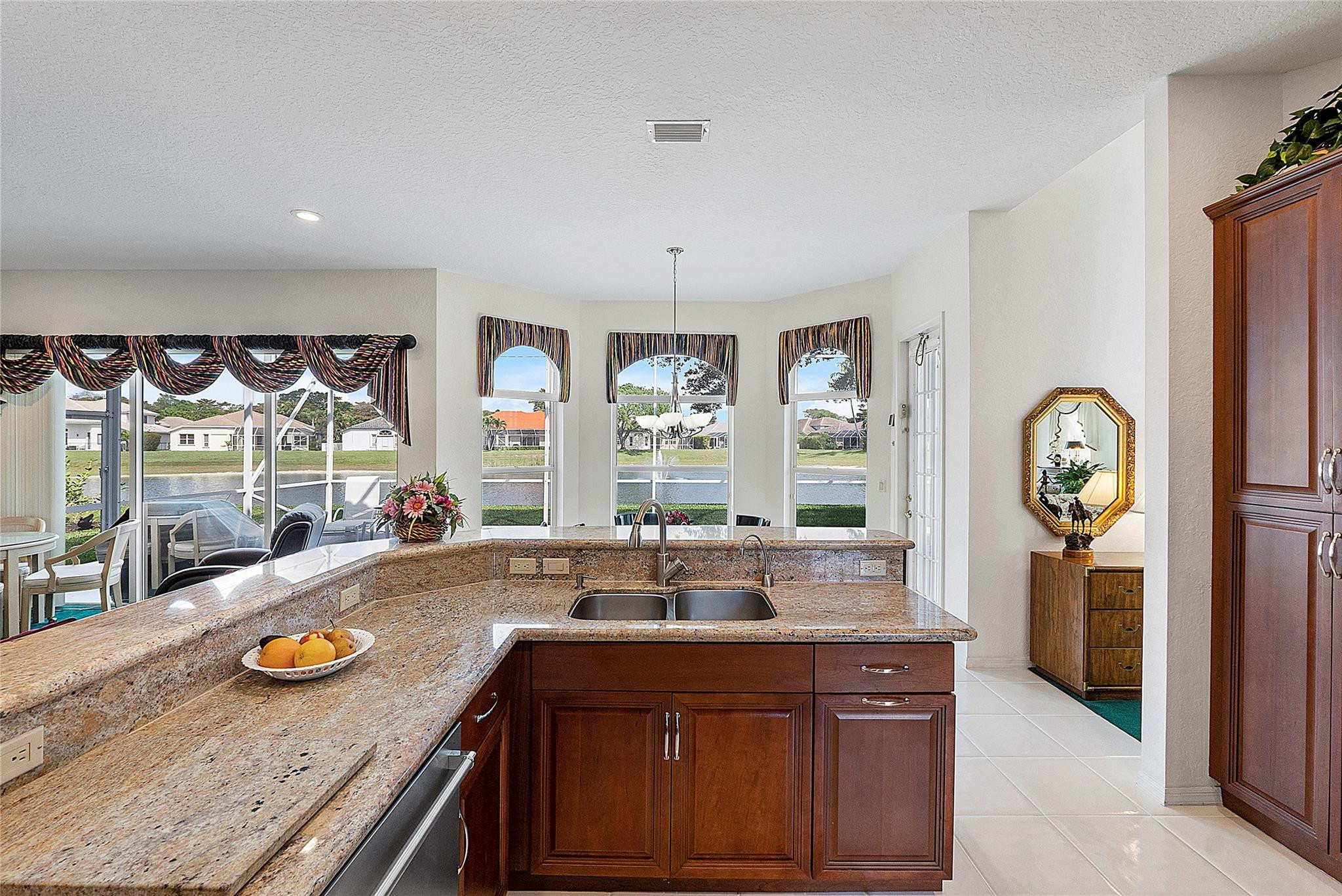 22293 Rushmore Place Boca Raton, FL 33428 - Photo 15 of 59 a kitchen with granite countertop a sink and a stove