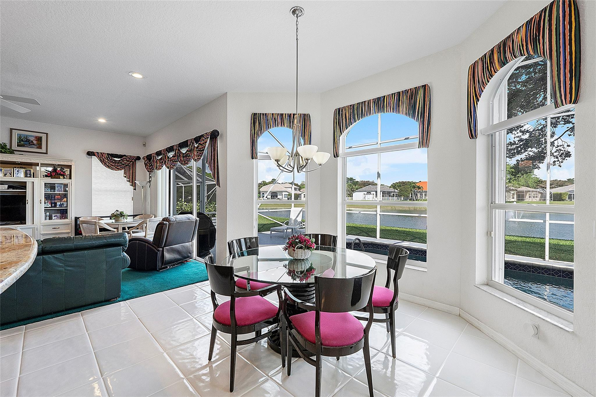 22293 Rushmore Place Boca Raton, FL 33428 - Photo 17 of 59 a dining room with furniture a chandelier and window