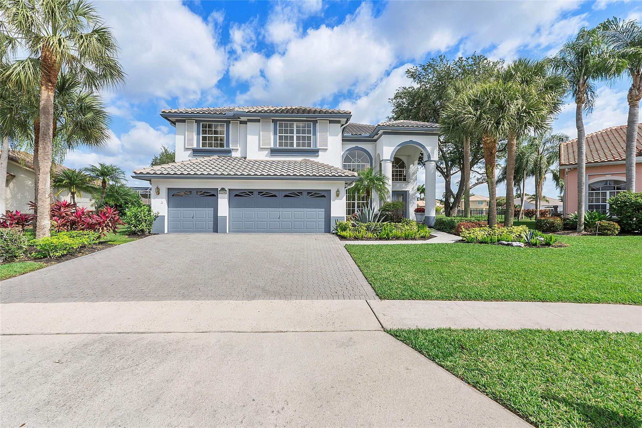 22293 Rushmore Place Boca Raton, FL 33428 - Photo 2 of 59 front view of house with a yard