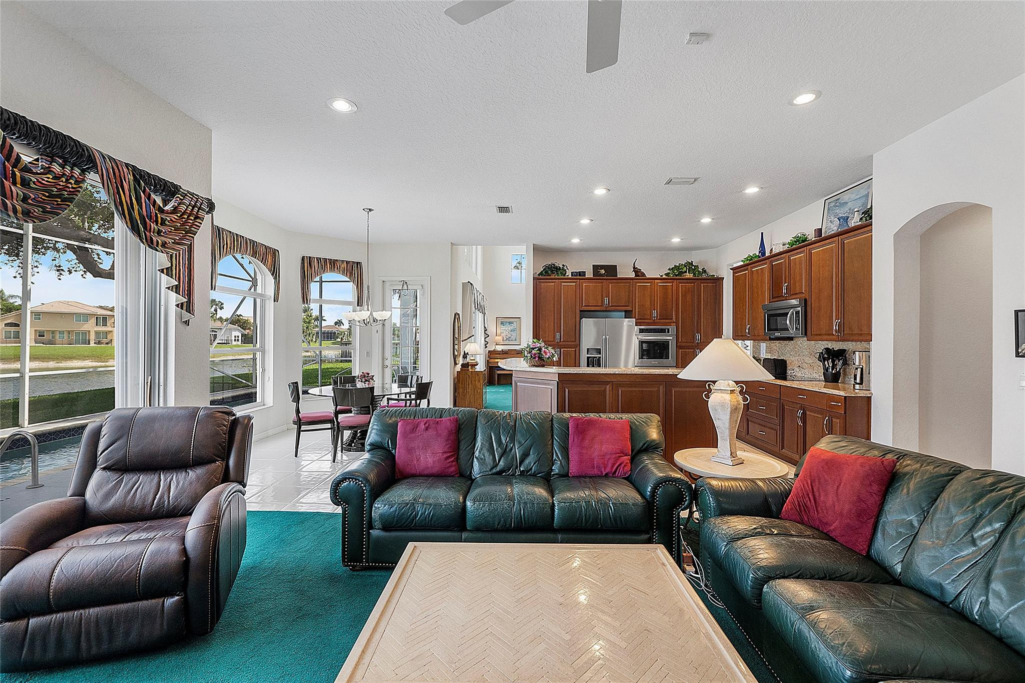 22293 Rushmore Place Boca Raton, FL 33428 - Photo 21 of 59 a living room with furniture kitchen view and a large window