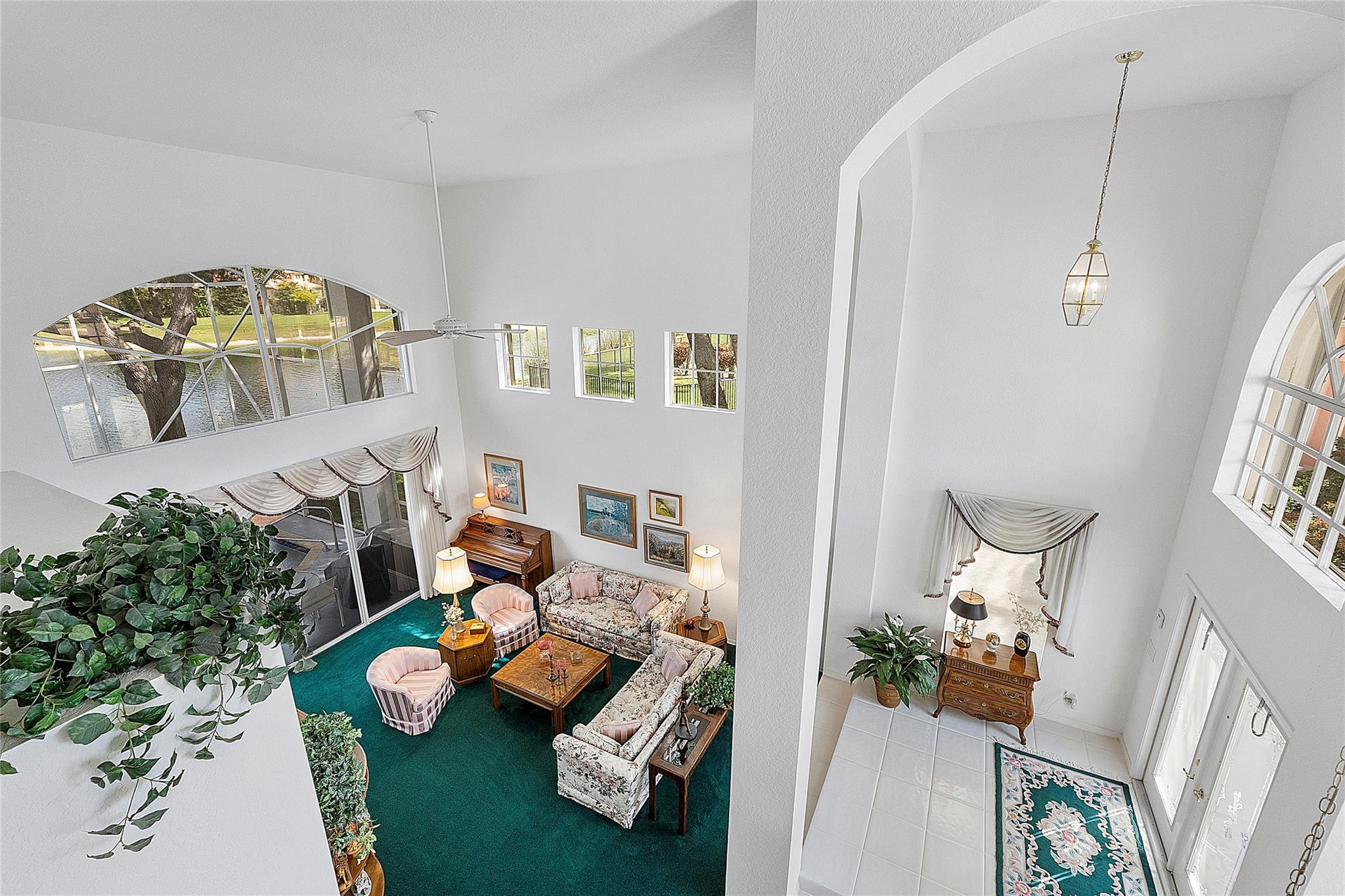 22293 Rushmore Place Boca Raton, FL 33428 - Photo 28 of 59 a living room with furniture and a chandelier