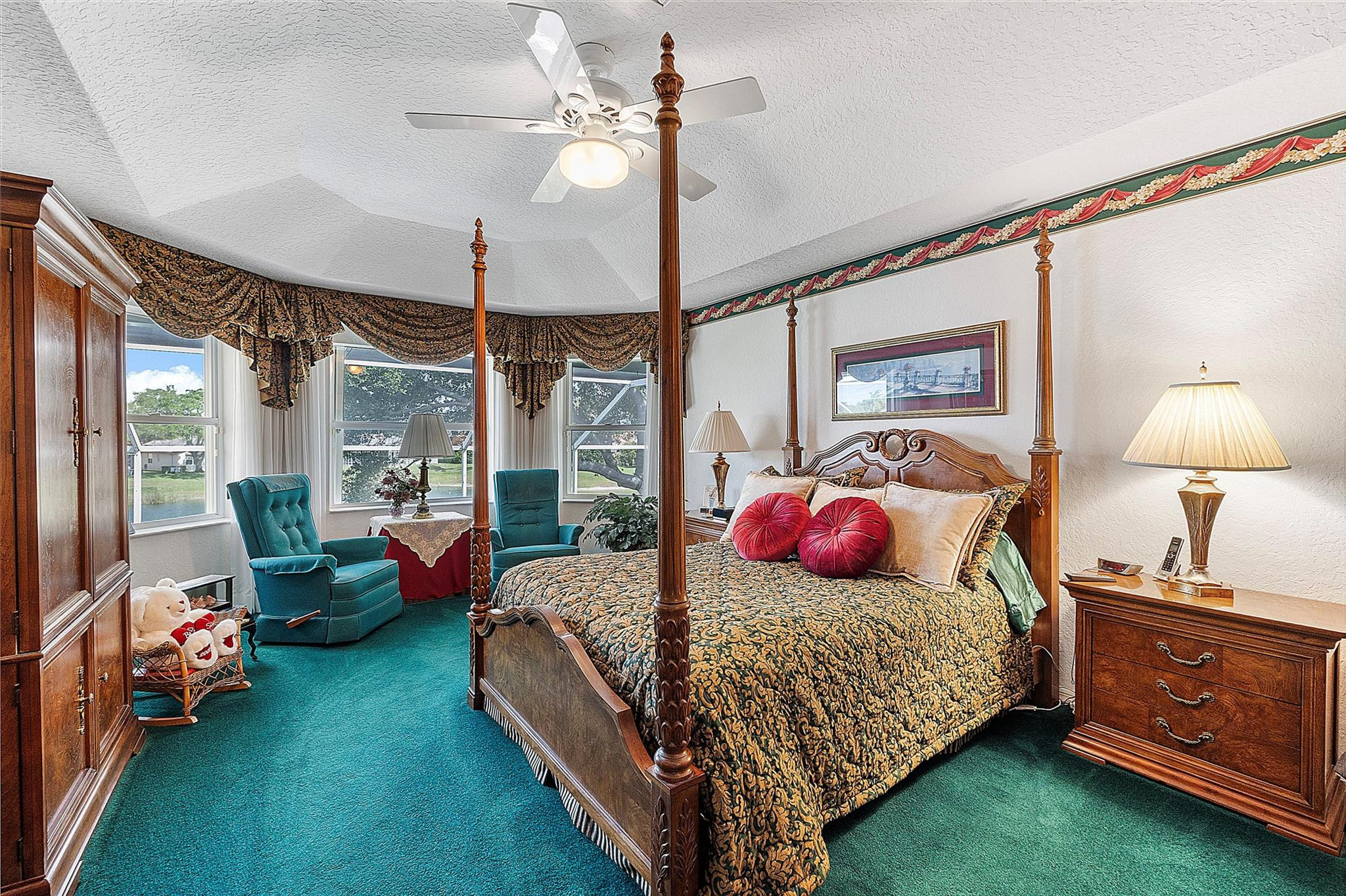 22293 Rushmore Place Boca Raton, FL 33428 - Photo 31 of 59 a bedroom with bed and a chandelier