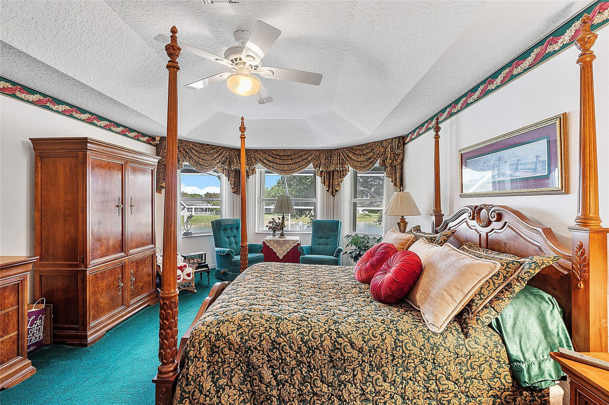 22293 Rushmore Place Boca Raton, FL 33428 - Photo 32 of 59 a bedroom with a bed and a chandelier
