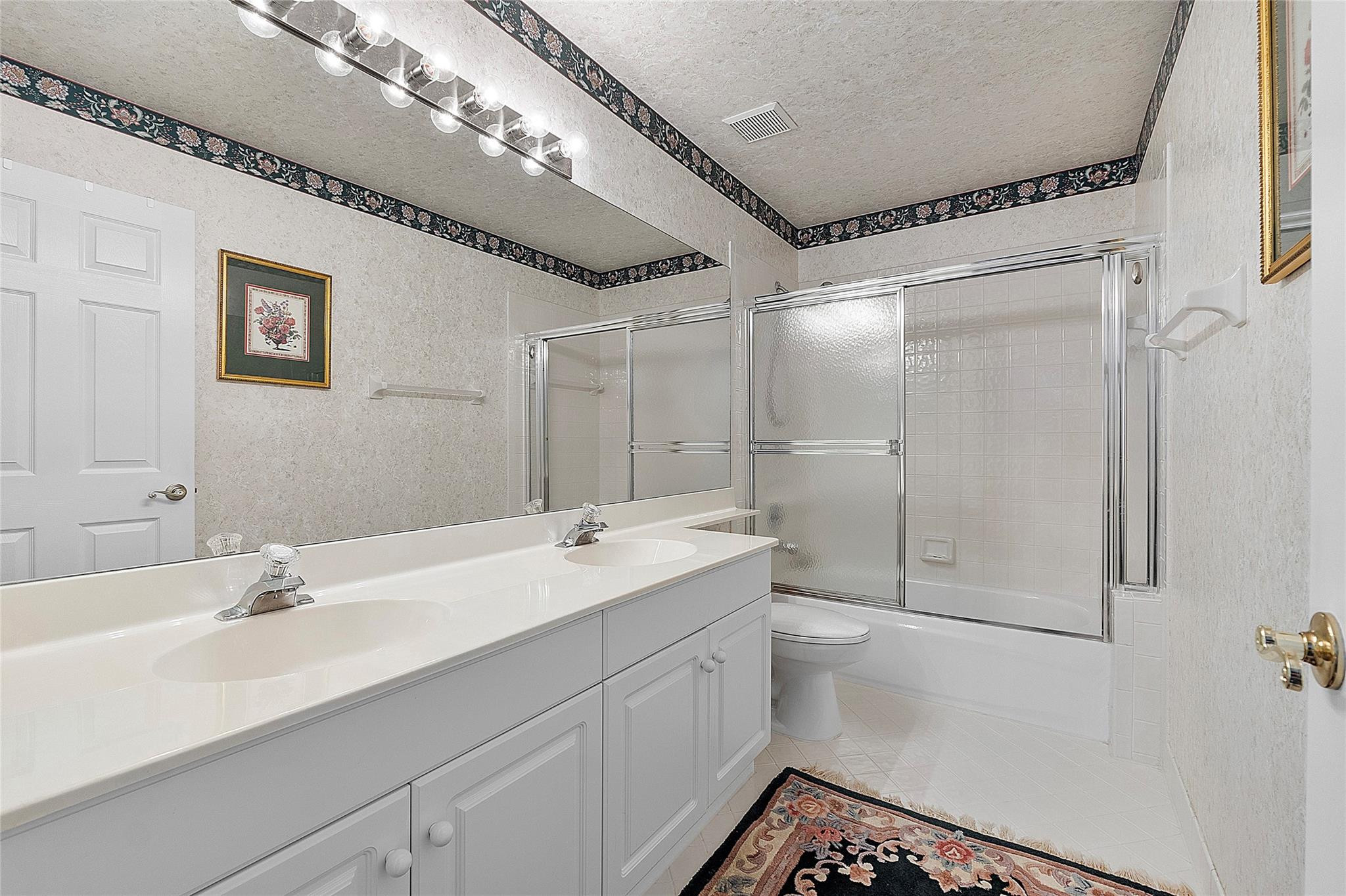 22293 Rushmore Place Boca Raton, FL 33428 - Photo 39 of 59 a bathroom with a double vanity sink mirror and shower