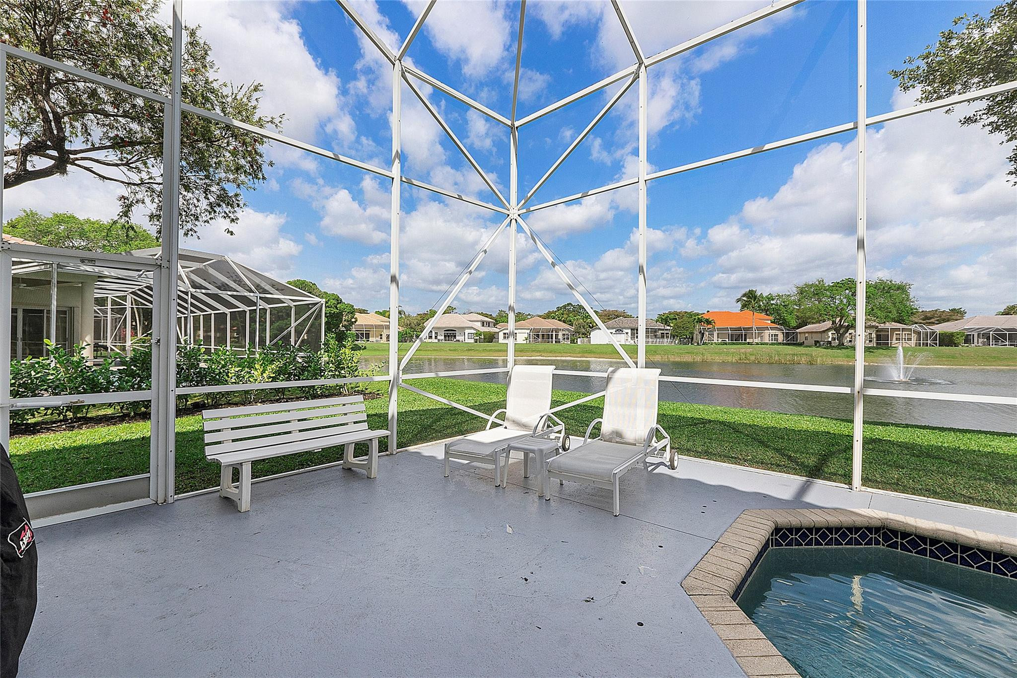 22293 Rushmore Place Boca Raton, FL 33428 - Photo 44 of 59 a view of a patio with a bench and chairs