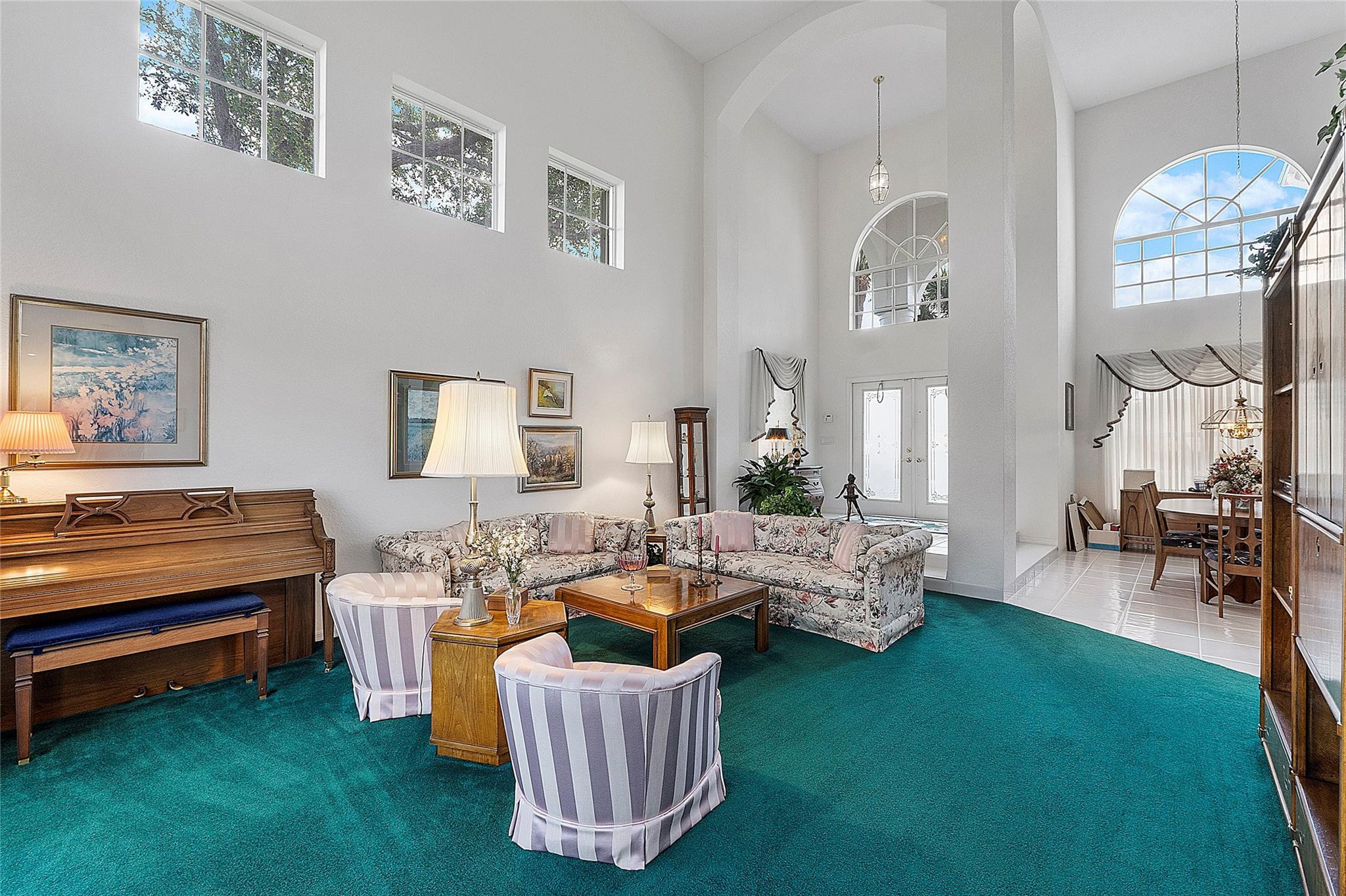 22293 Rushmore Place Boca Raton, FL 33428 - Photo 10 of 59 a living room with furniture and a chandelier